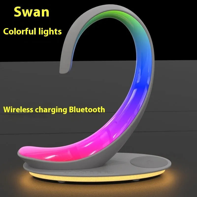 White swan decorative lamp with wireless charging pad and Bluetooth speaker functionality