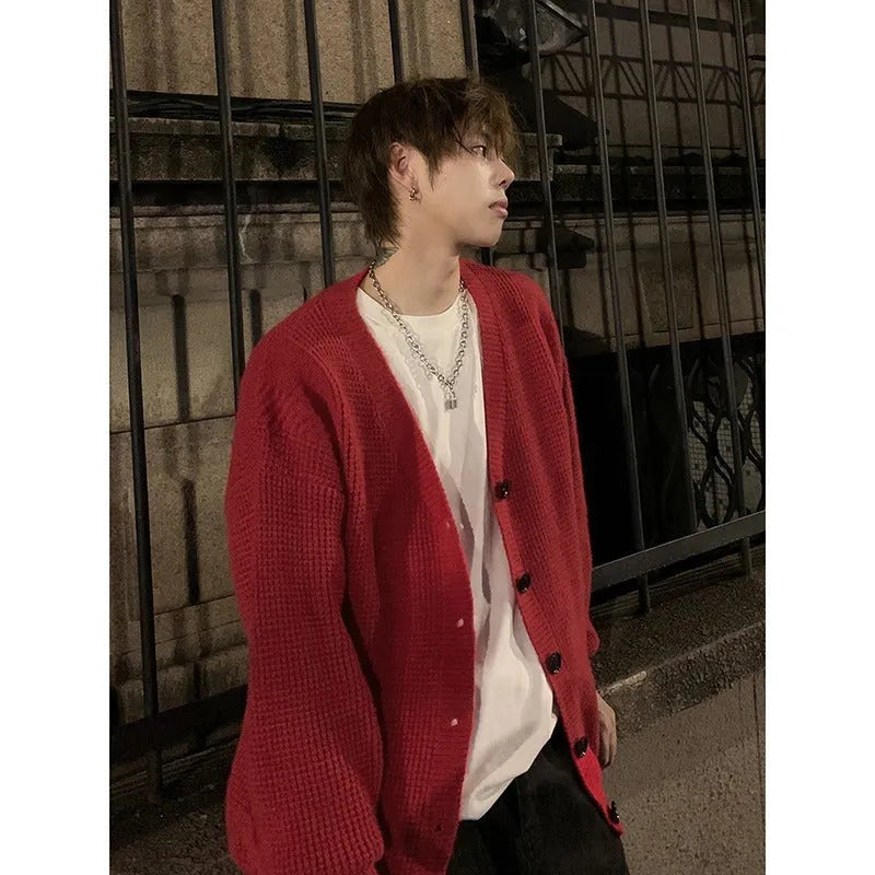 Men's loose fit casual cardigan sweater in army green, shown on a hanger.