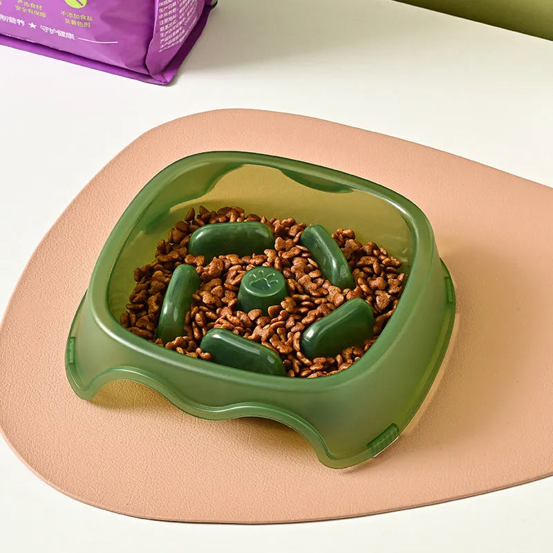 Blue plastic dog slow feeder bowl with anti-choking design on white background