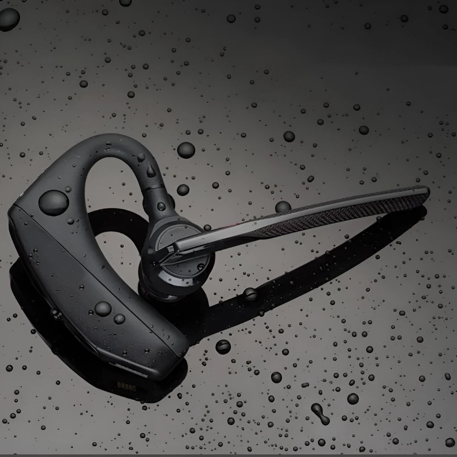 Black plastic Bluetooth sports headphones showing a battery display and USB charging port.