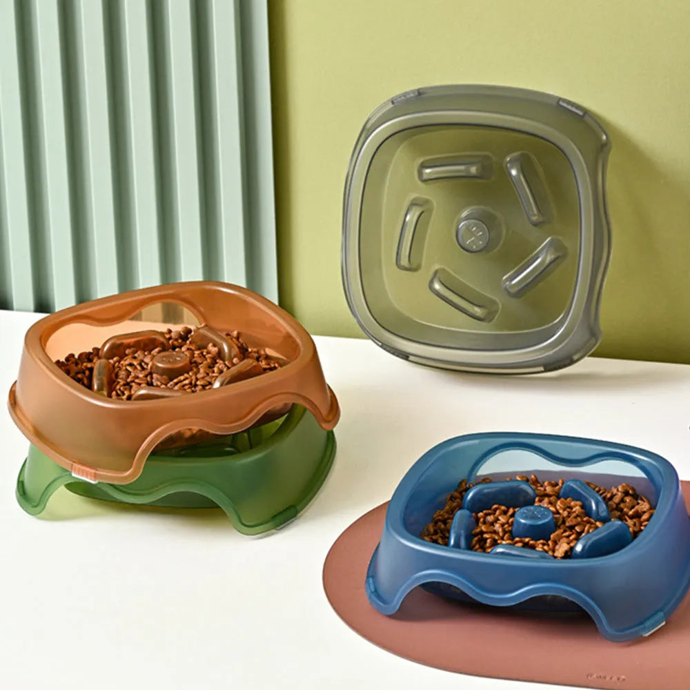 Blue plastic dog slow feeder bowl with anti-choking design on white background