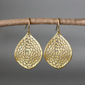 Gold-coloured retro drop earrings with a hollow leaf pendant design.