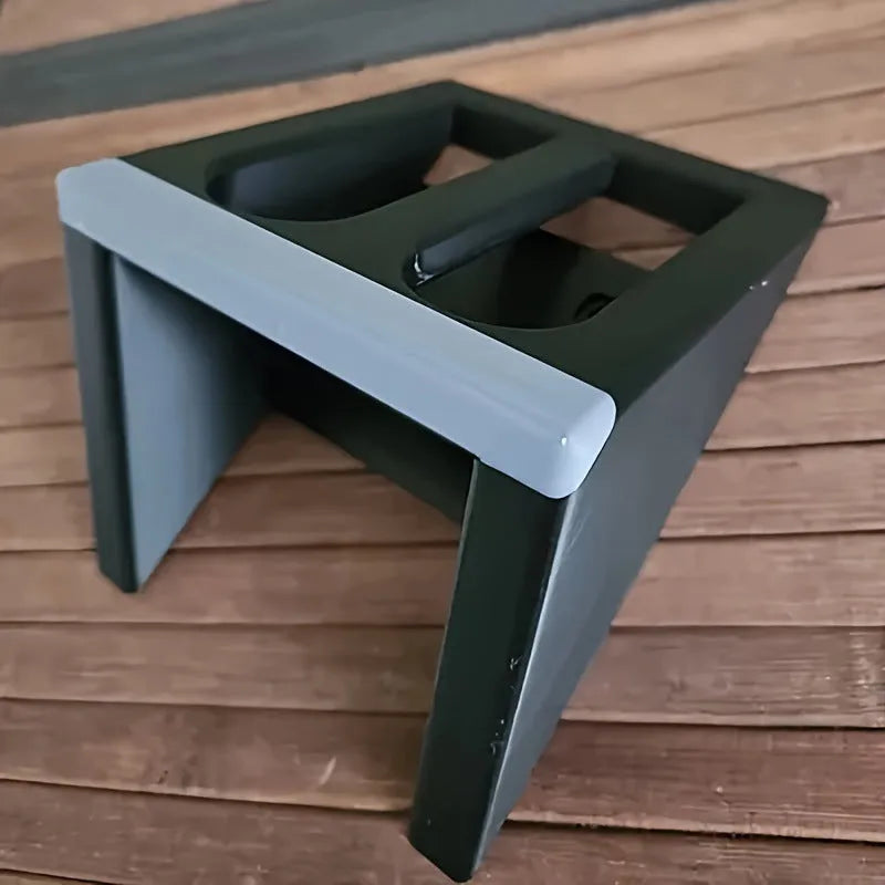 Black plastic pistol display stand with punk-style moulding for 1:1 scale gun models.