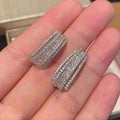 White gold colour geometry stud earrings with inlaid zircon details on copper bases