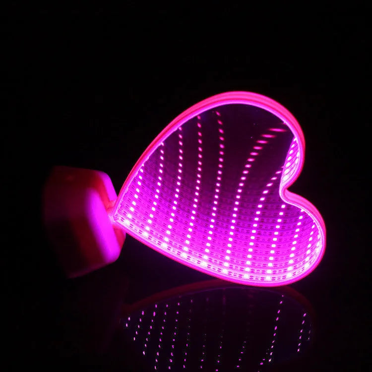 Rose red double-sided LED love tunnel decorative light on a table.