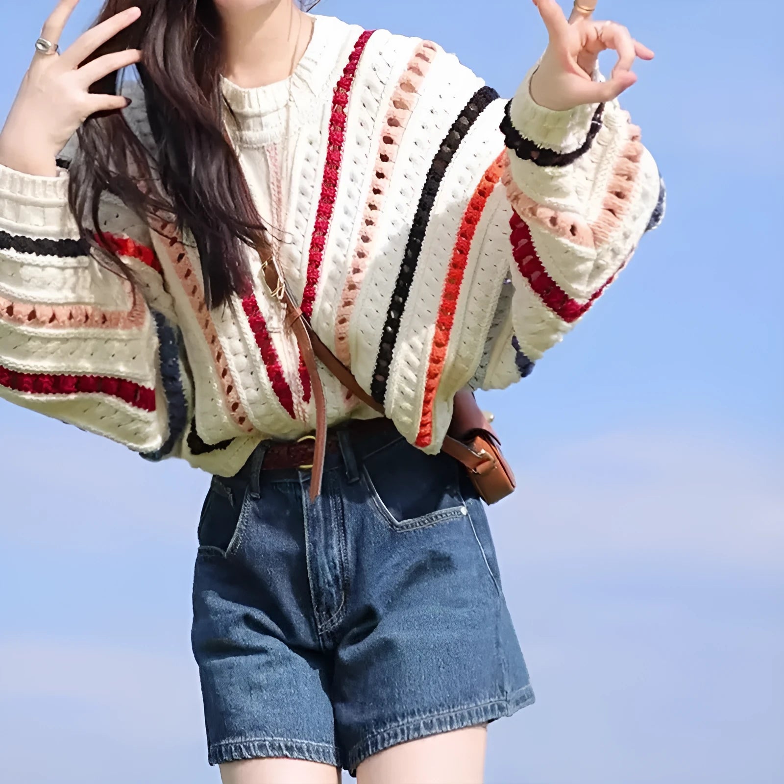 Rainbow striped pullover sweater with batwing sleeves and round neck in loose fit casual style