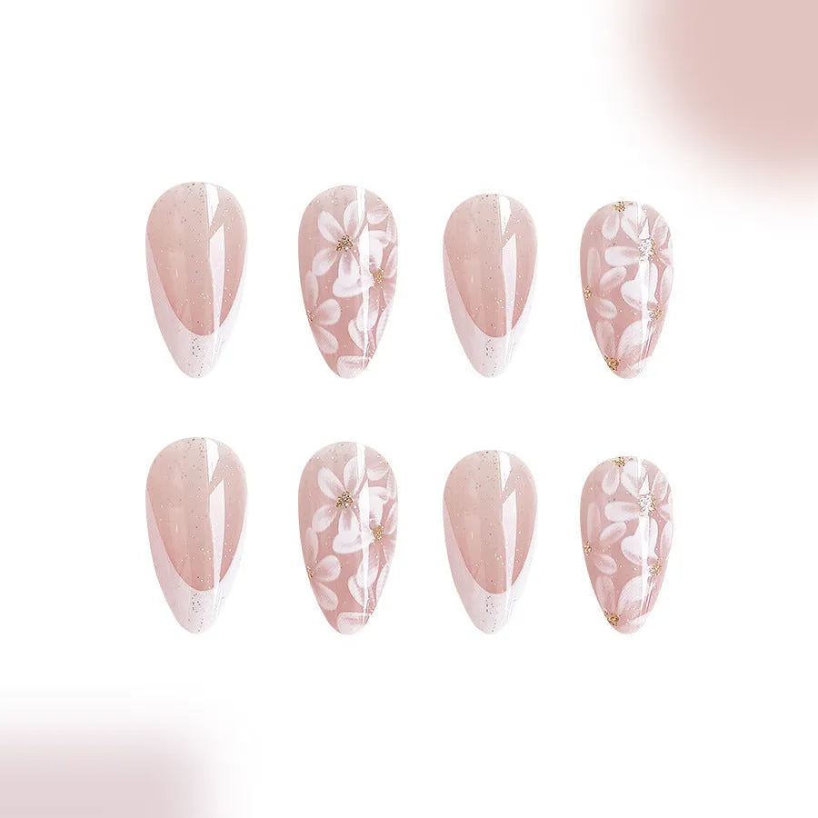 Short almond French manicure press-on nails with glitter flower designs in colour C625