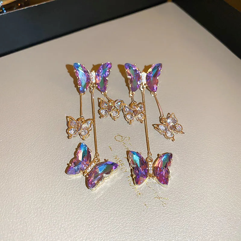 Silver needle colour crystal butterfly earrings with blue-purple electroplated finish and tassel elements