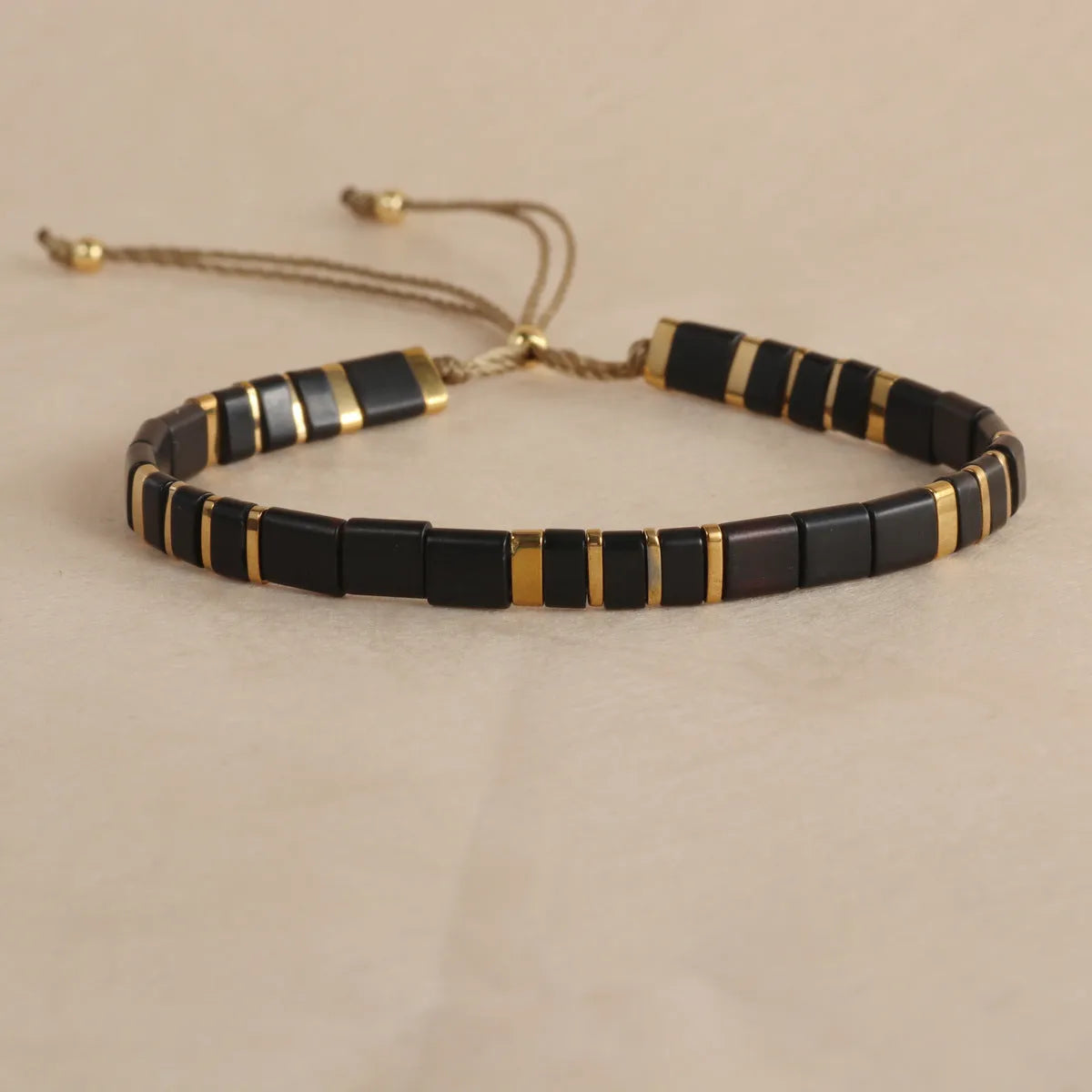 Glass and coloured glaze beaded bracelet with geometric round beads in five colour options