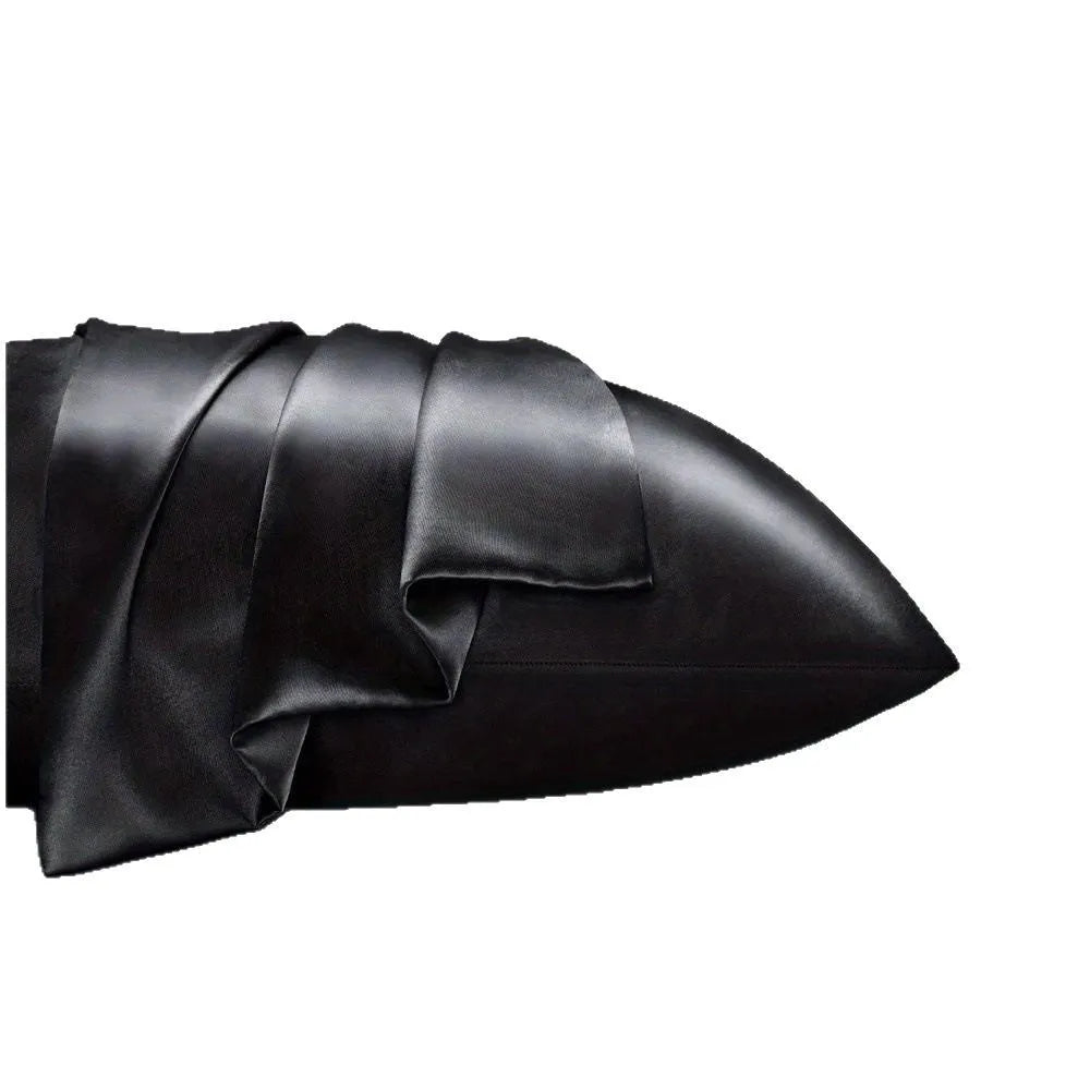 A pair of solid colour satin pillowcases in a chosen shade, showing the smooth plain weave fabric texture.