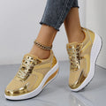 Women's gold platform trainers with mesh upper, cross-strap design and waterproof platform