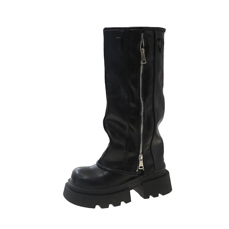 Black platform muffin pants Martin boots with high-cut sock and square rubber heel.