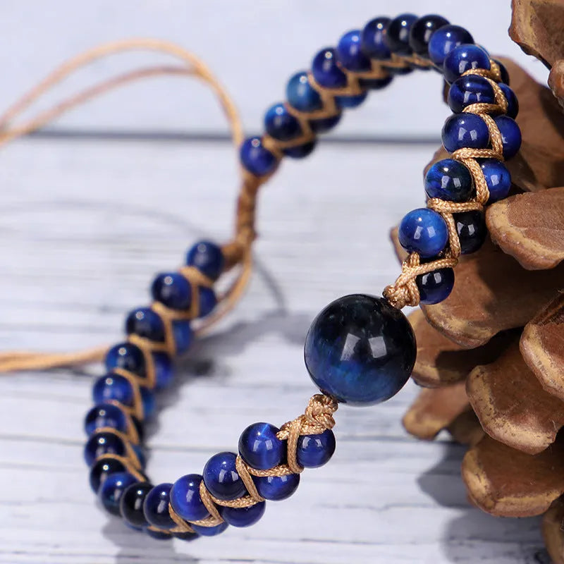 Handmade woven pull bracelet with tigereye and amethyst beads in geometric pattern
