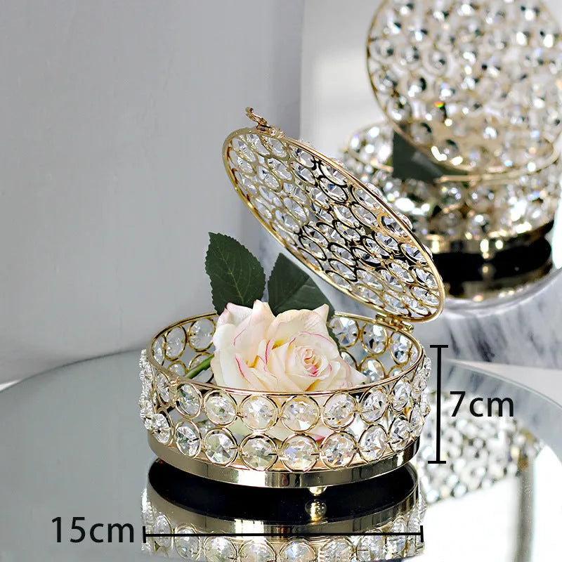 Crystal glass jewellery box with transparent sides and a French gold metal frame.