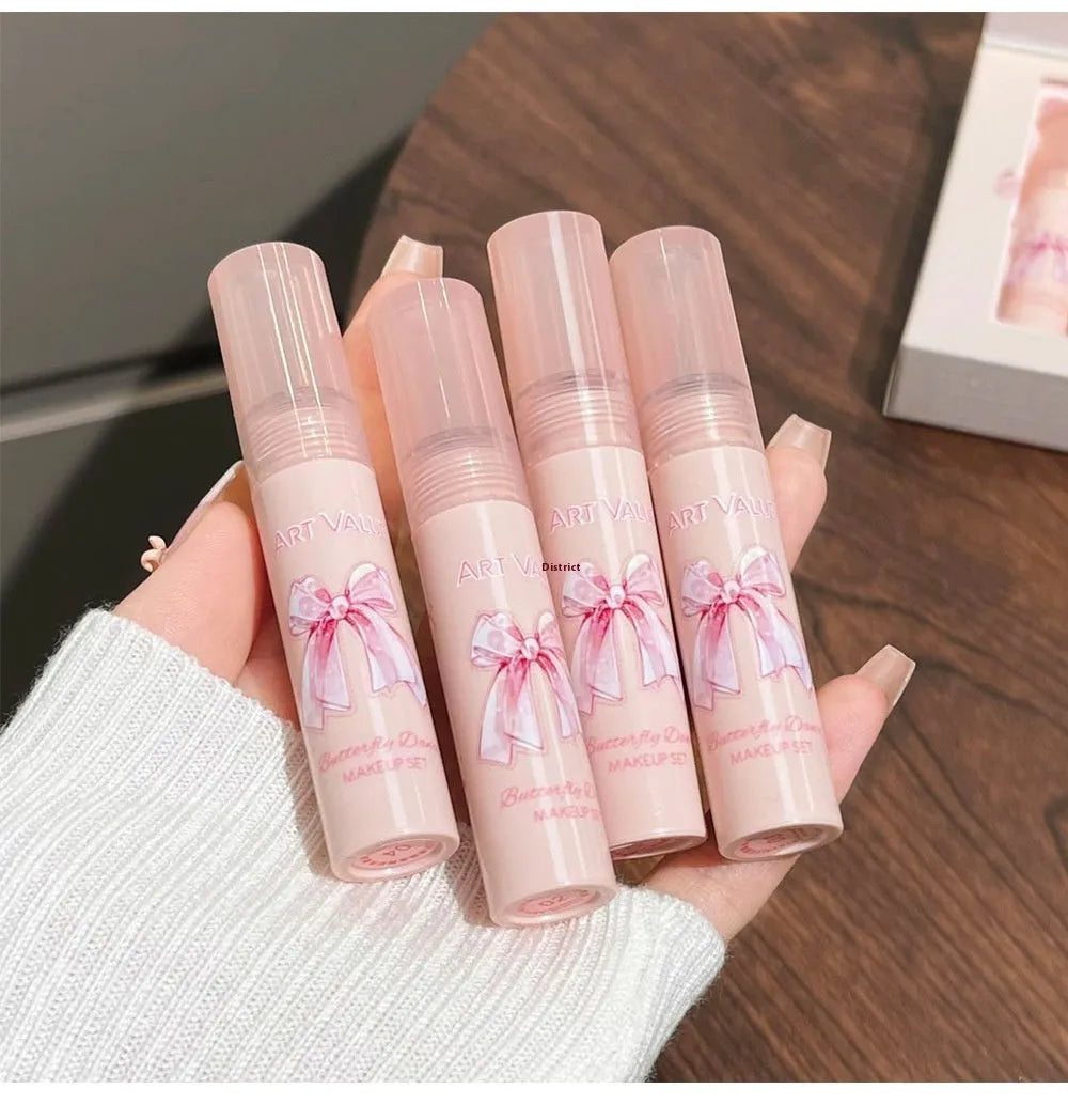 Butterfly Box cosmetics set showing four matte lip muds, pink powder blusher and necklace