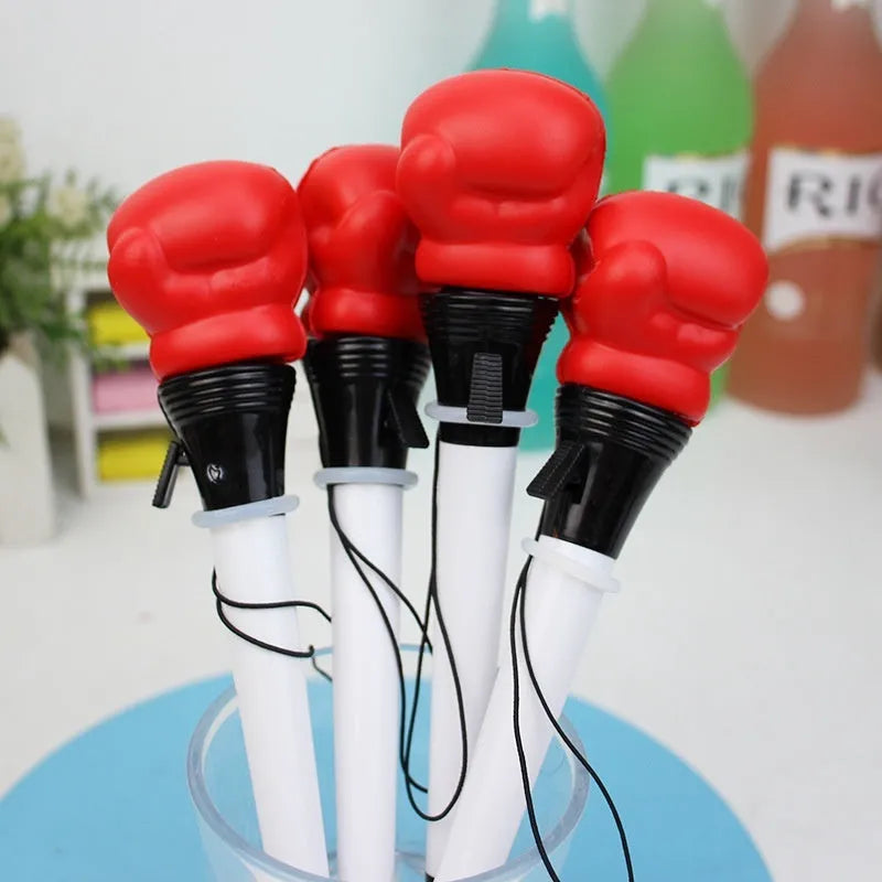 Four pressure relief boxing press ejection pens with black refills and 0.7mm bullet tips