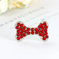 Rhinestone dog bone hair clip in alloy, white colour, on a neutral background