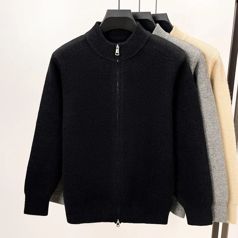 Men's black zip-up knitted cardigan with a stand collar on a hanger
