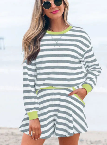 Women's black stripe lounge set with long sleeve blouse and loose matching shorts.