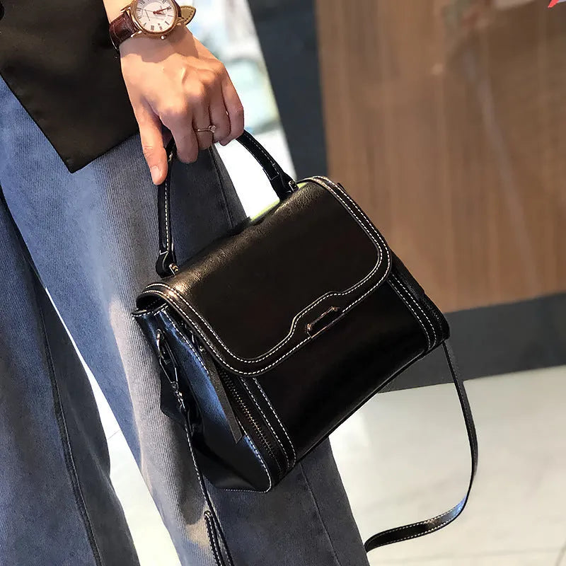 Genuine leather women's messenger bag in horizontal square shape with multiple pockets and double shoulder straps