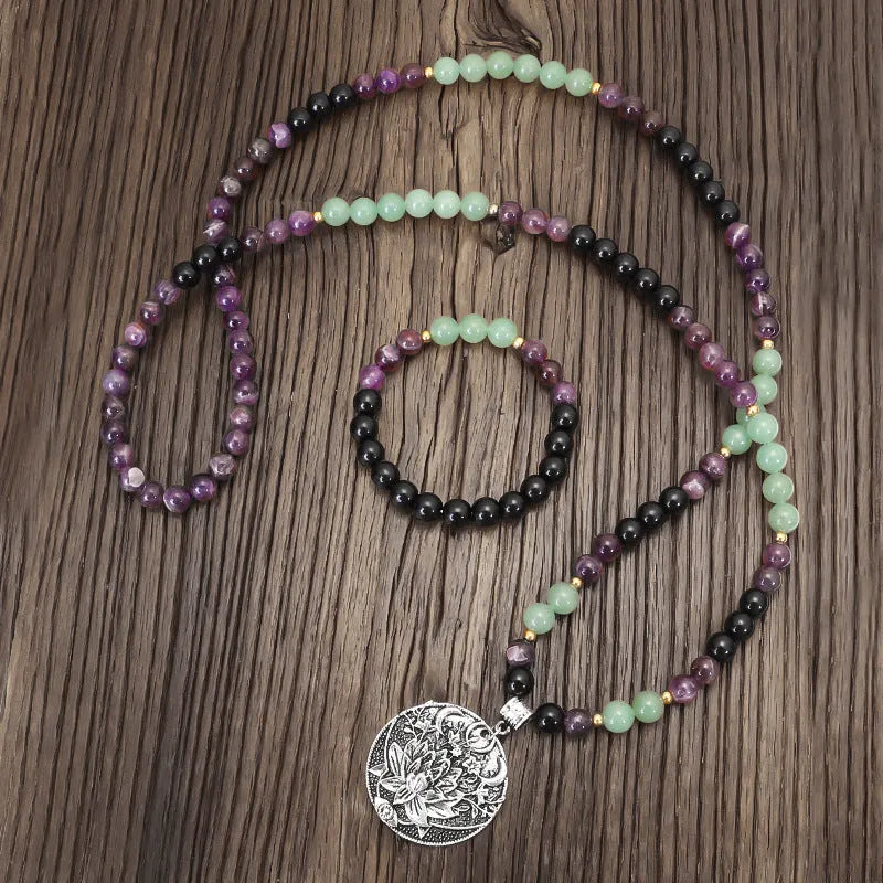 Yoga lotus pendant necklace with handmade stone beads and matching bracelet on adjustable chain.