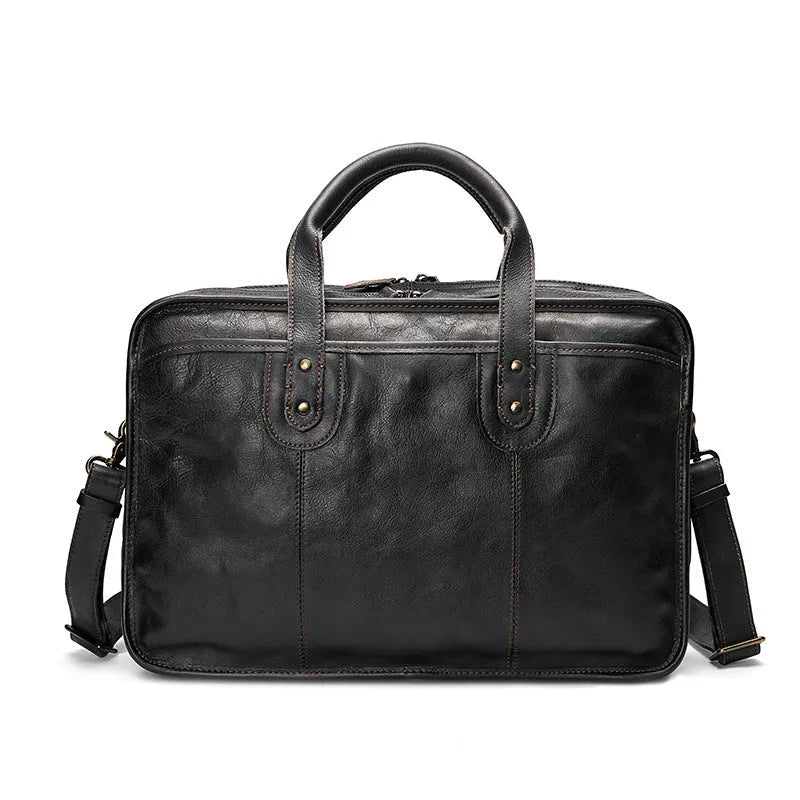 Large vintage leather men's briefcase with internal computer and camera pockets measuring 42cm wide