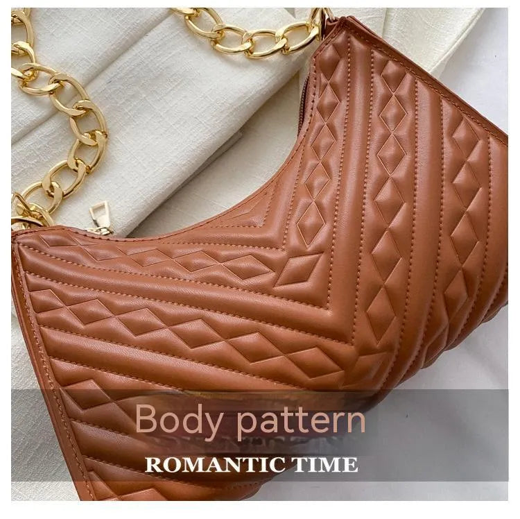 Brown pleated chain shoulder bag showing vertical square shape and adjustable strap