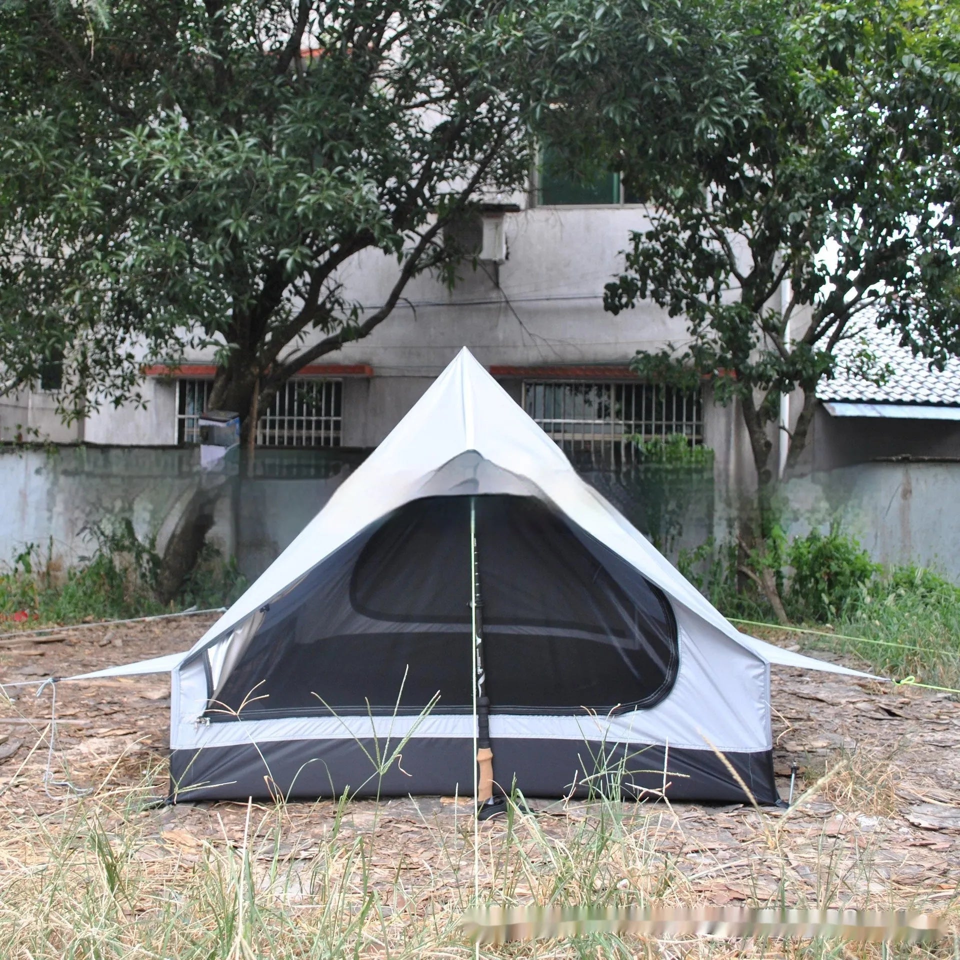 Brown or white A-line pole-free cabin tent for 2-3 people with hiking cane support