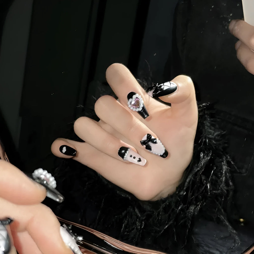 Black and pink hand-painted heart design detachable manicure showing bow pattern and size options