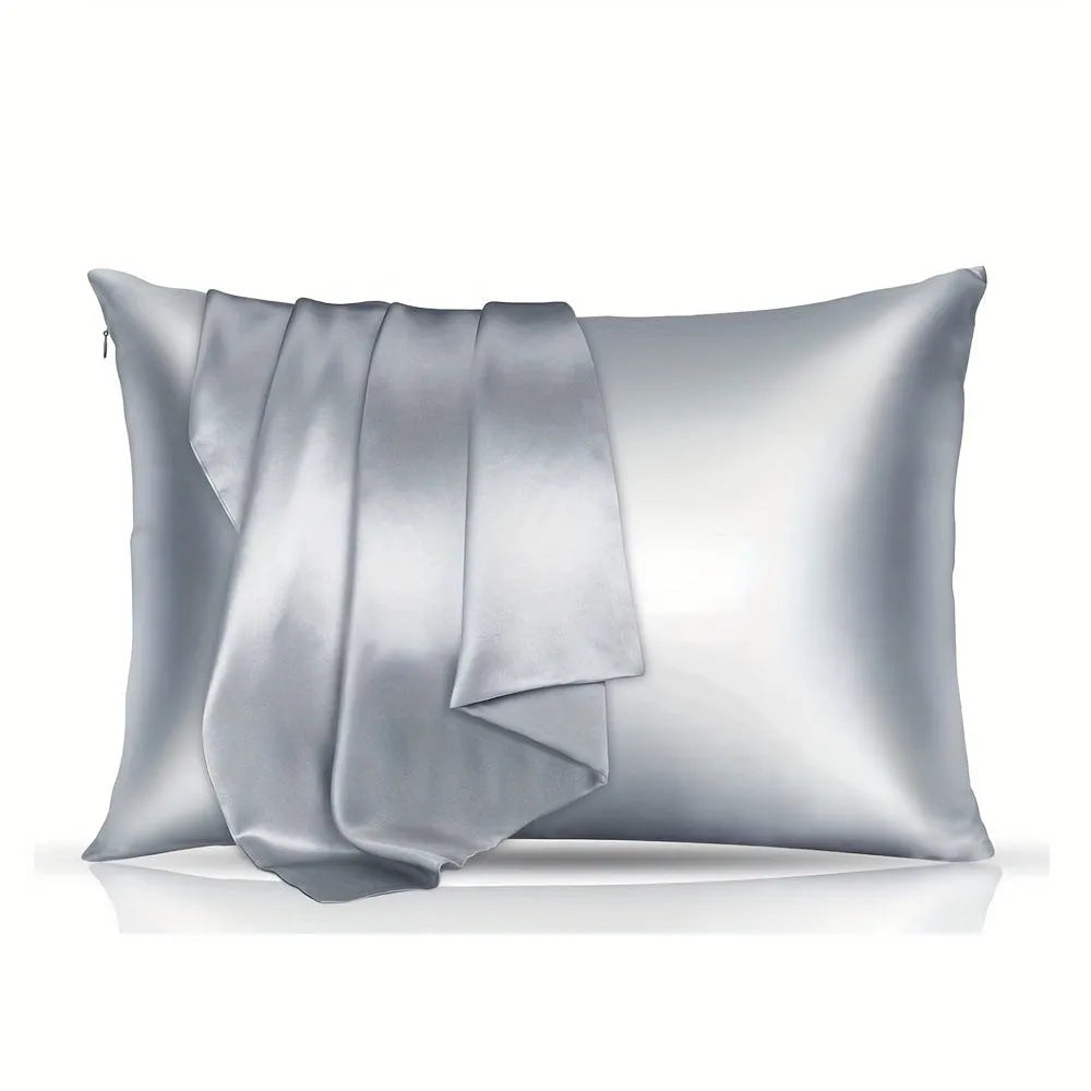 A pair of solid colour satin pillowcases in a chosen shade, showing the smooth plain weave fabric texture.