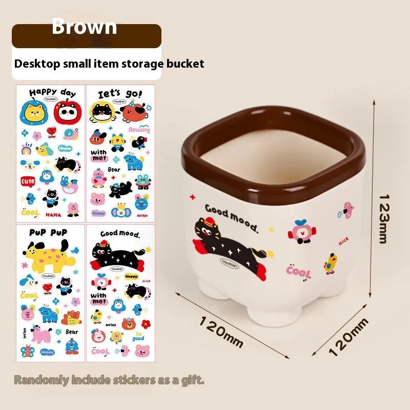Red and brown cartoon-style plastic desktop storage organiser with grid pattern for stationery and sundries.
