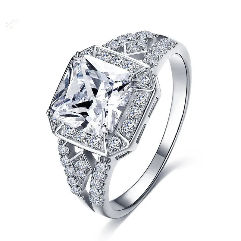 Geometric hollowed zircon ring in platinum colour on copper with quadrilateral design
