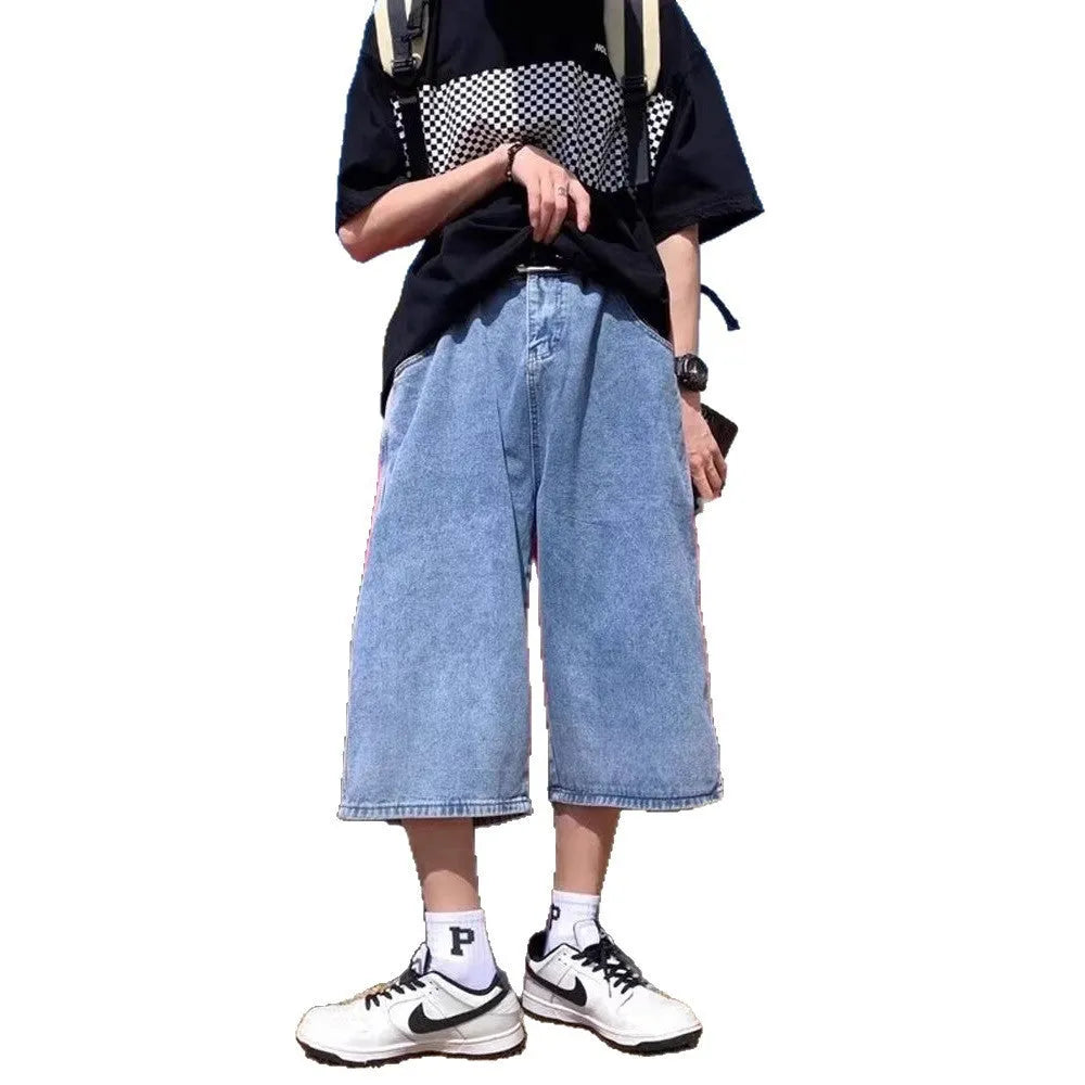 Men's washed blue denim pirate shorts with high waist and cropped length on a plain background.