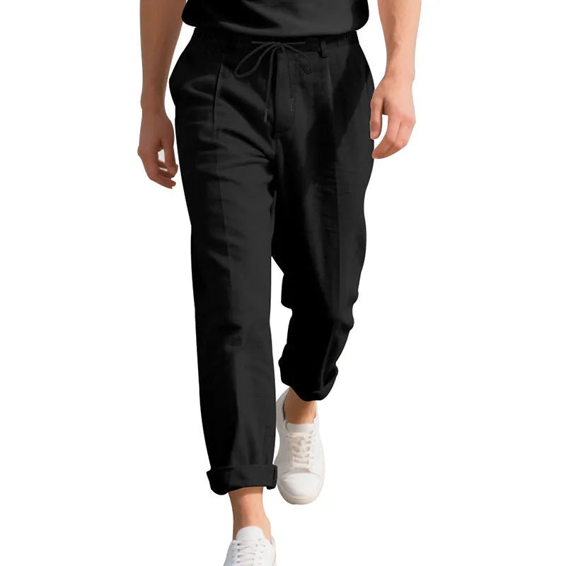 Men's light beige linen casual trousers with drawstring waist and straight-leg fit on a hanger.