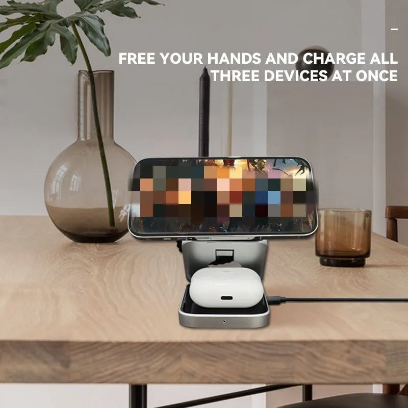 Foldable three-in-one wireless charging bracket for Apple, Samsung phones, and Google Pixel Watch on a desk.