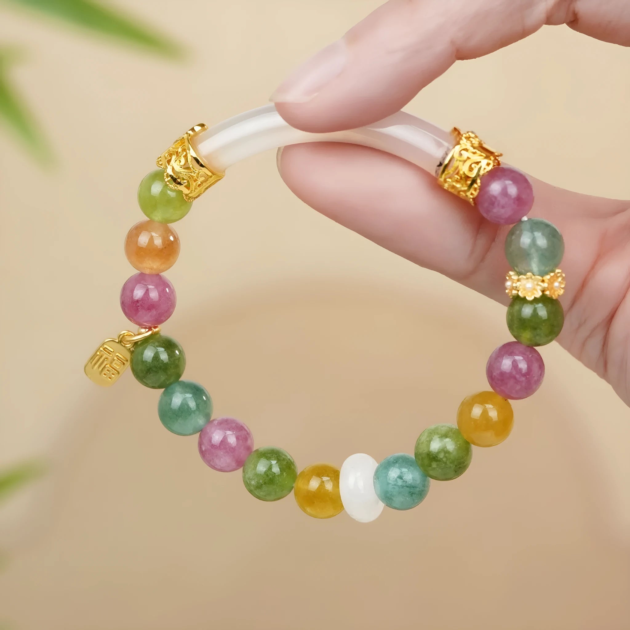 Women's tourmaline half bracelet with rainbow electroplated colour accents on natural stone beads