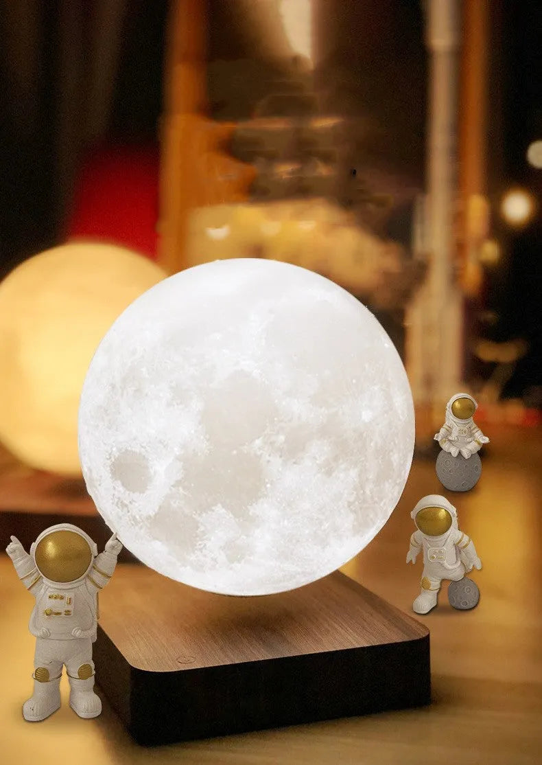 Moon Earth maglev floating LED night light with levitating planet and astronaut figurines on base