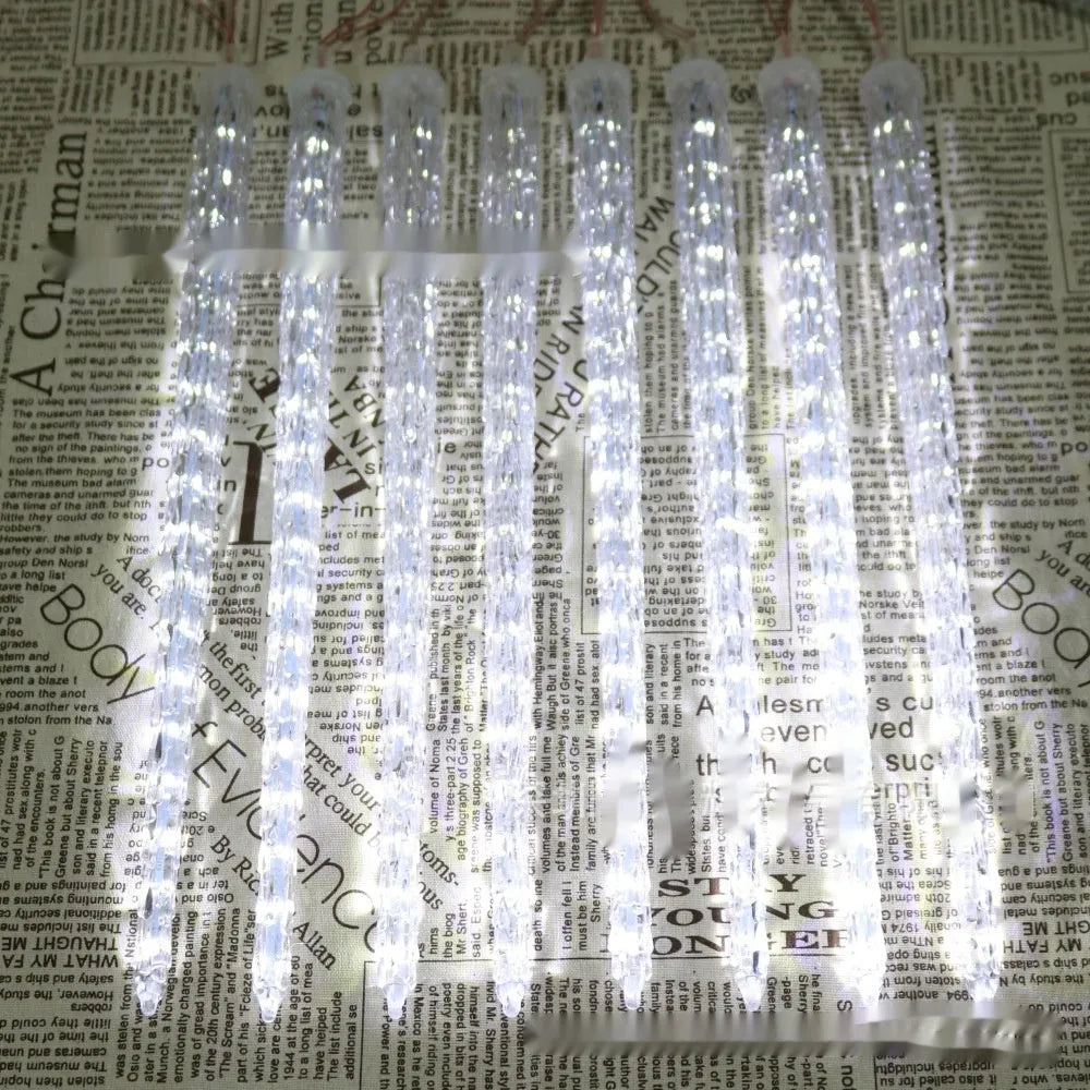 Solar-powered LED ice cone shaped meteor shower garden festoon lamp with remote control.