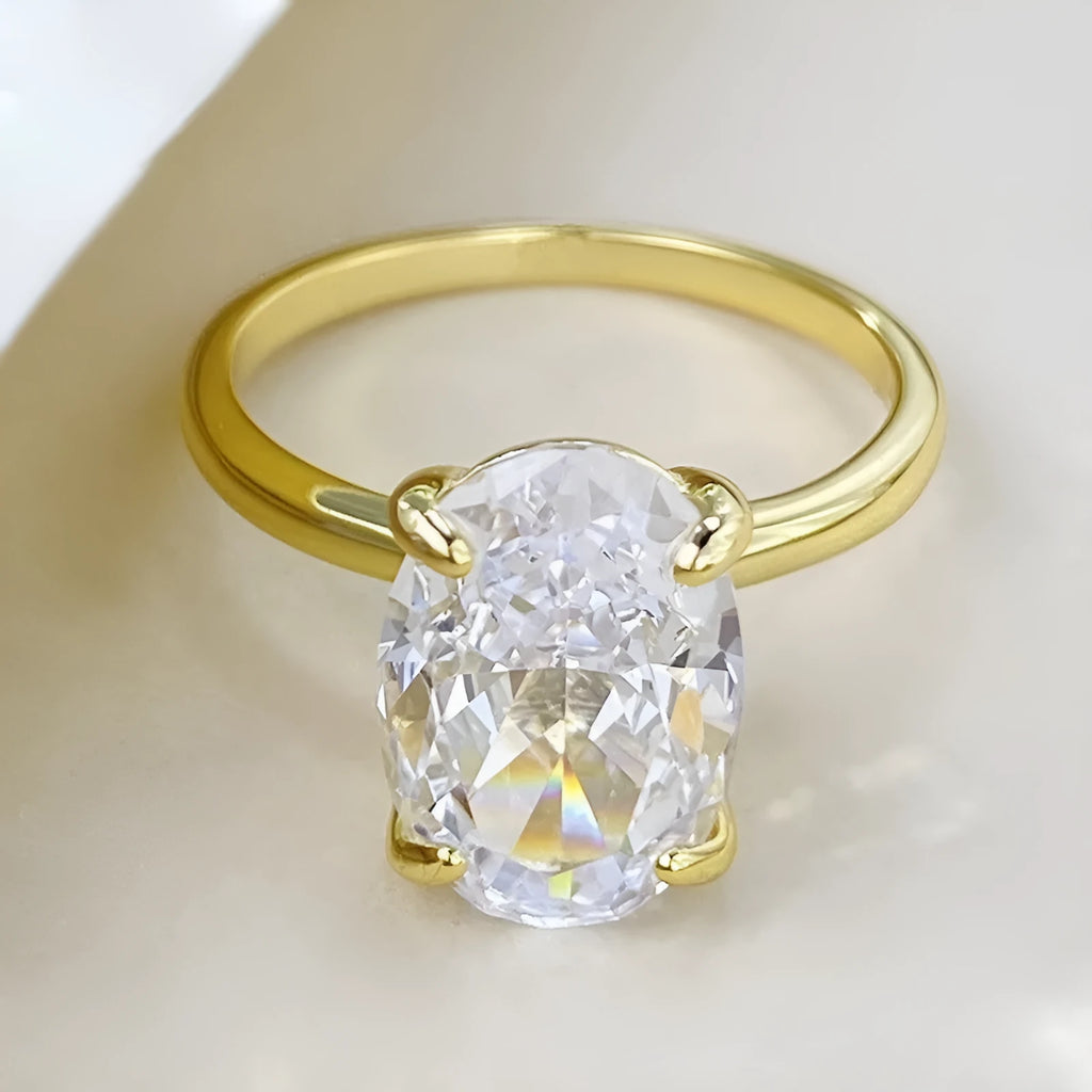 Oval 9 silver ring with four-claw setting holding 6x9mm hand-cut gemstone