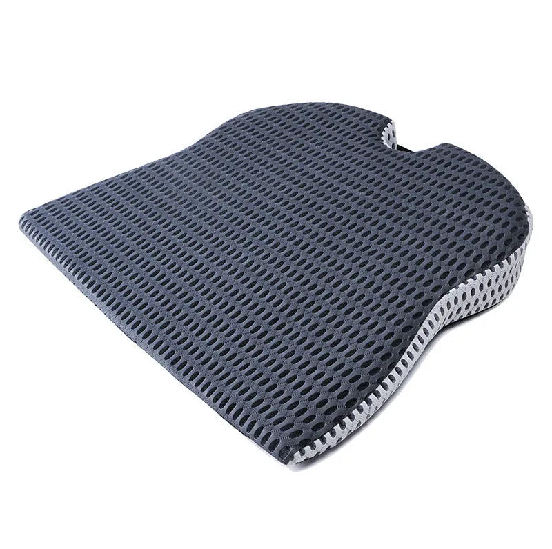 Memory foam seat cushion in grey with elastic strap on a car seat