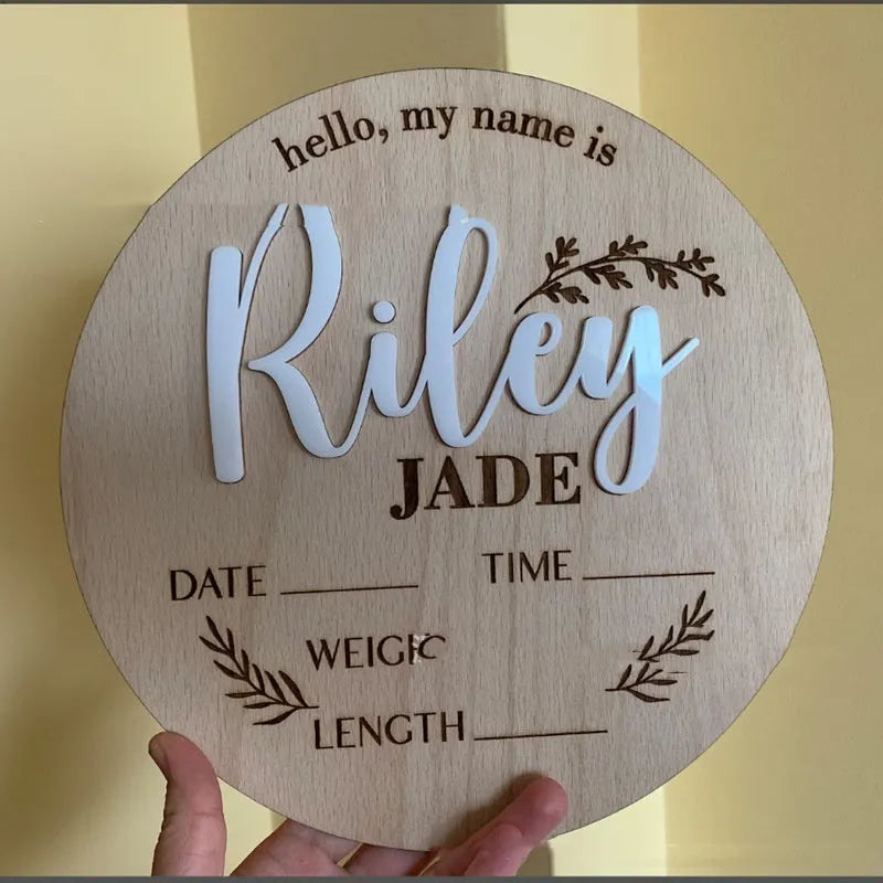 Square wooden baby name plaque showing birth information, 15cm on each side.