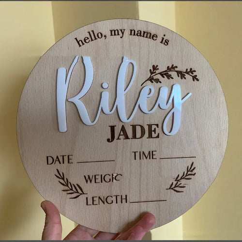 Square wooden baby name plaque showing birth information, 15cm on each side.