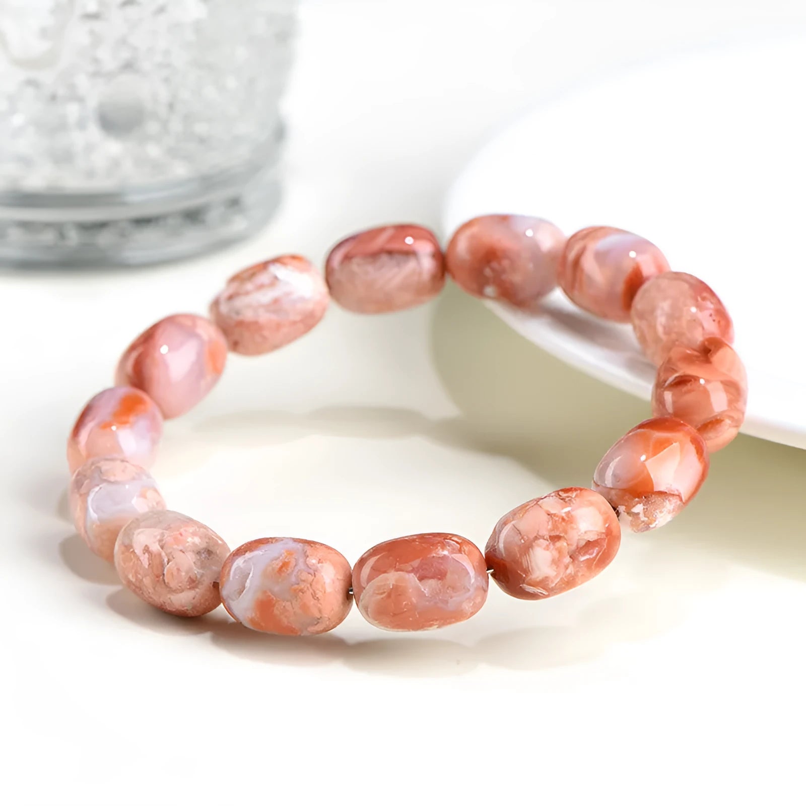 Natural cherry blossom agate barrel bead bracelet with 10mm by 14mm geometry design and ruyi element