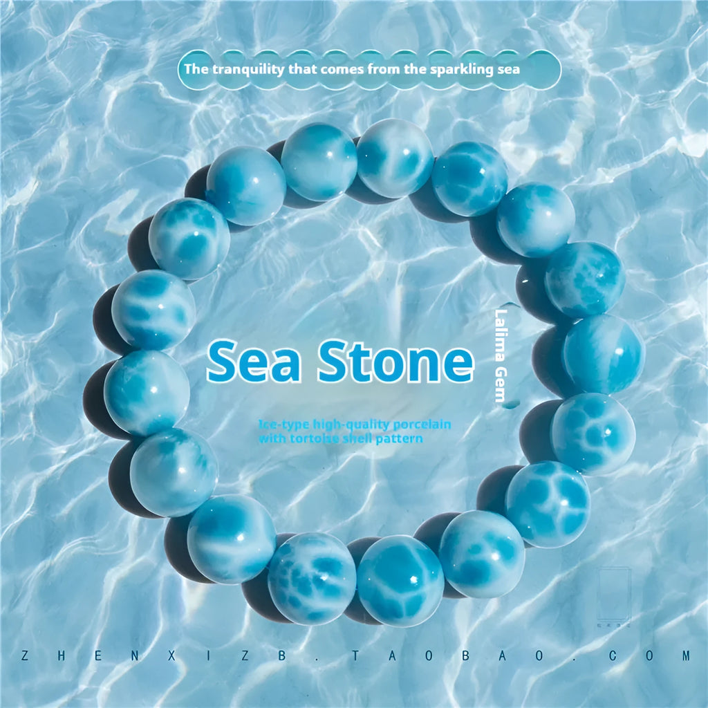 Blue Bodhi bracelet with sea-pattern crystal beads and pearl accents in Maillard style on wrist