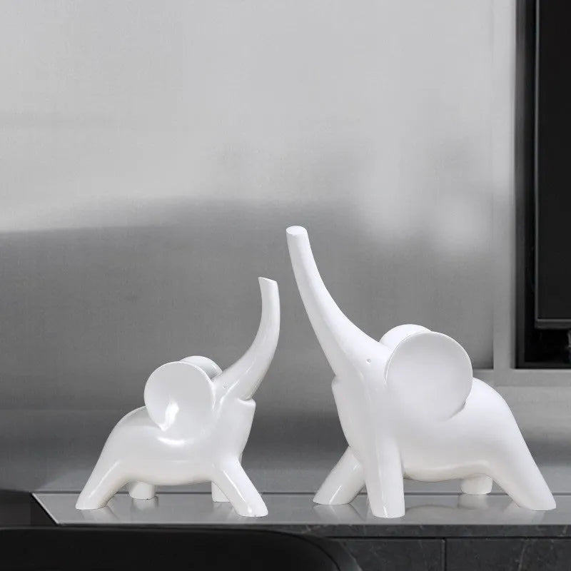 Modern resin elephant ornament in rose gold colour displayed on wooden surface