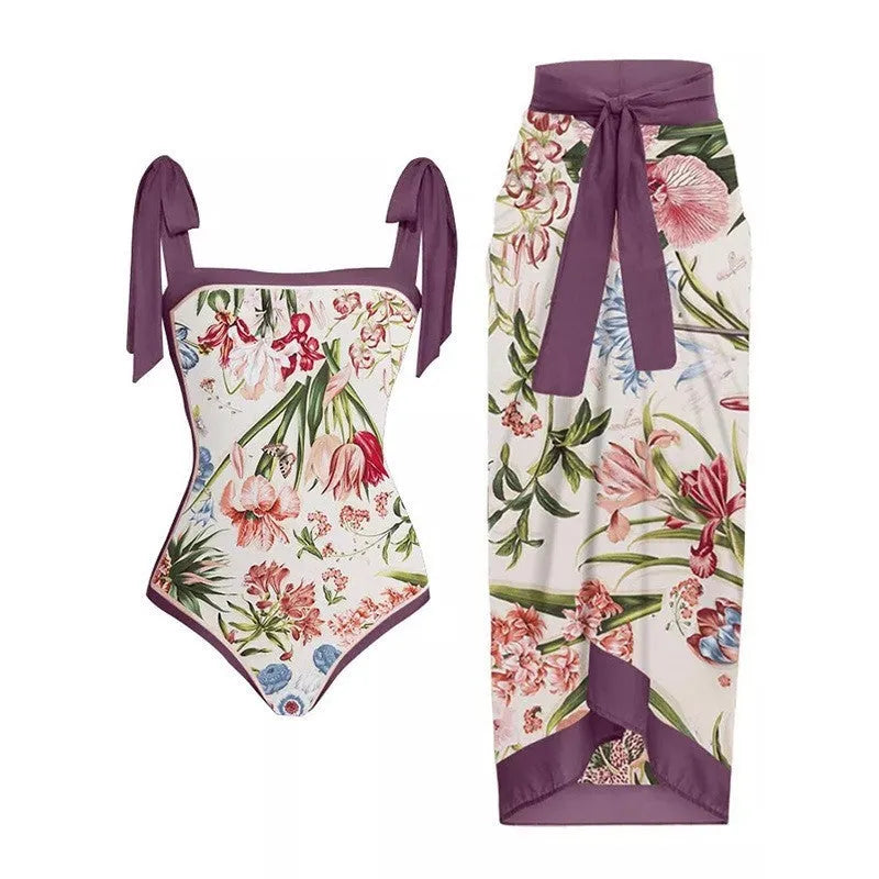 Women's yellow one-piece swimsuit with floral pattern and matching white chiffon skirt.