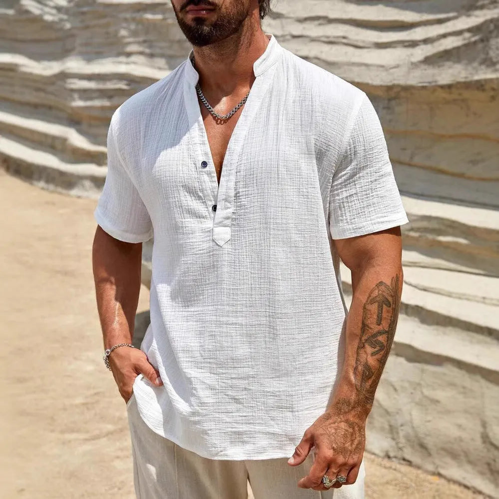 Men's solid colour stand collar short-sleeved shirt with slit detail in light blue.