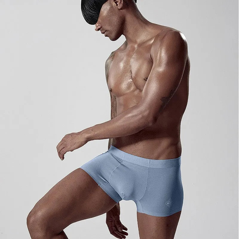 Men's seamless modal underwear in green, pink, and white with mid waist design