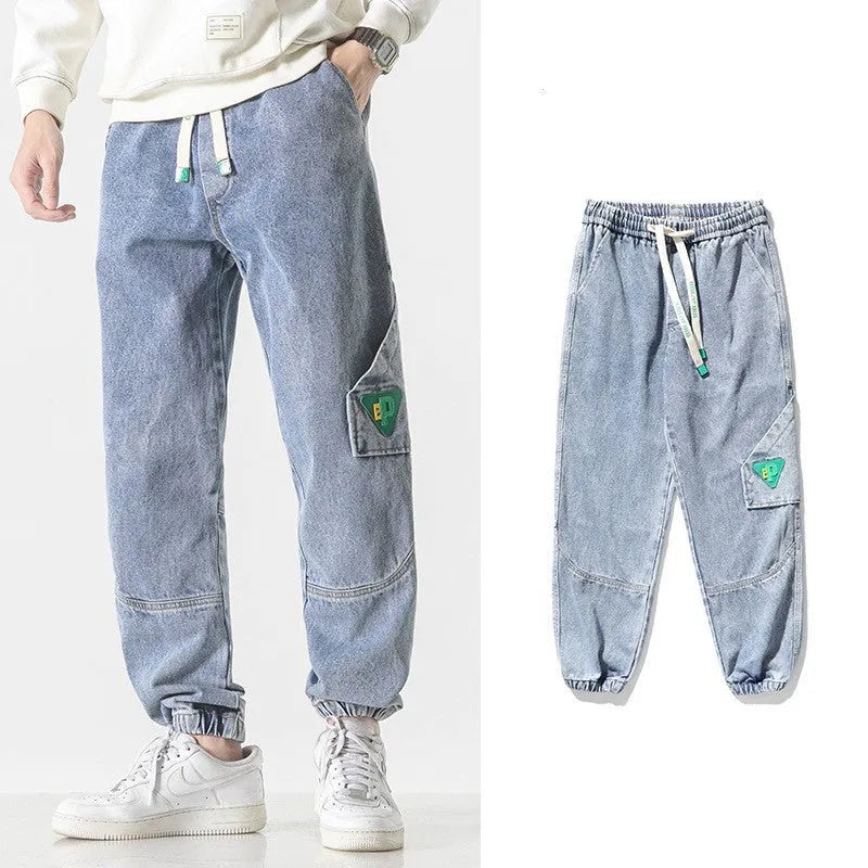 Men's loose-fit tapered cotton trousers in black, blue and grey colours showing mid-waist design
