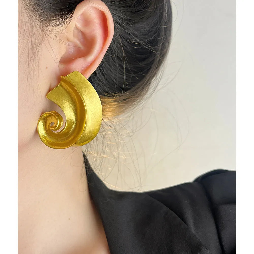 Geometric drop ear studs with retro design in gold or silver finish measuring 5cm length